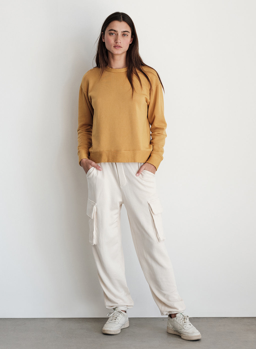 Softest Fleece Cargo Jogger in Cream-model with her hands in pockets